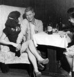 On May 27, 1949, Shanghai came under Communist control. Despite Communist claims that the city was taken over in a peaceful manner, one of the first actions taken by the Communist Party was to clean up the portion of the population that were considered counter-revolutionaries, including bar girls and prostitutes.<br/><br/>

Most foreign firms moved their offices from Shanghai to Hong Kong, specifically North Point, whose Eastern District became known as 'Little Shanghai.